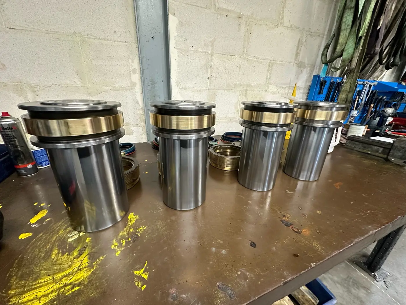 Hydraulic cylinders being repaired for a customer